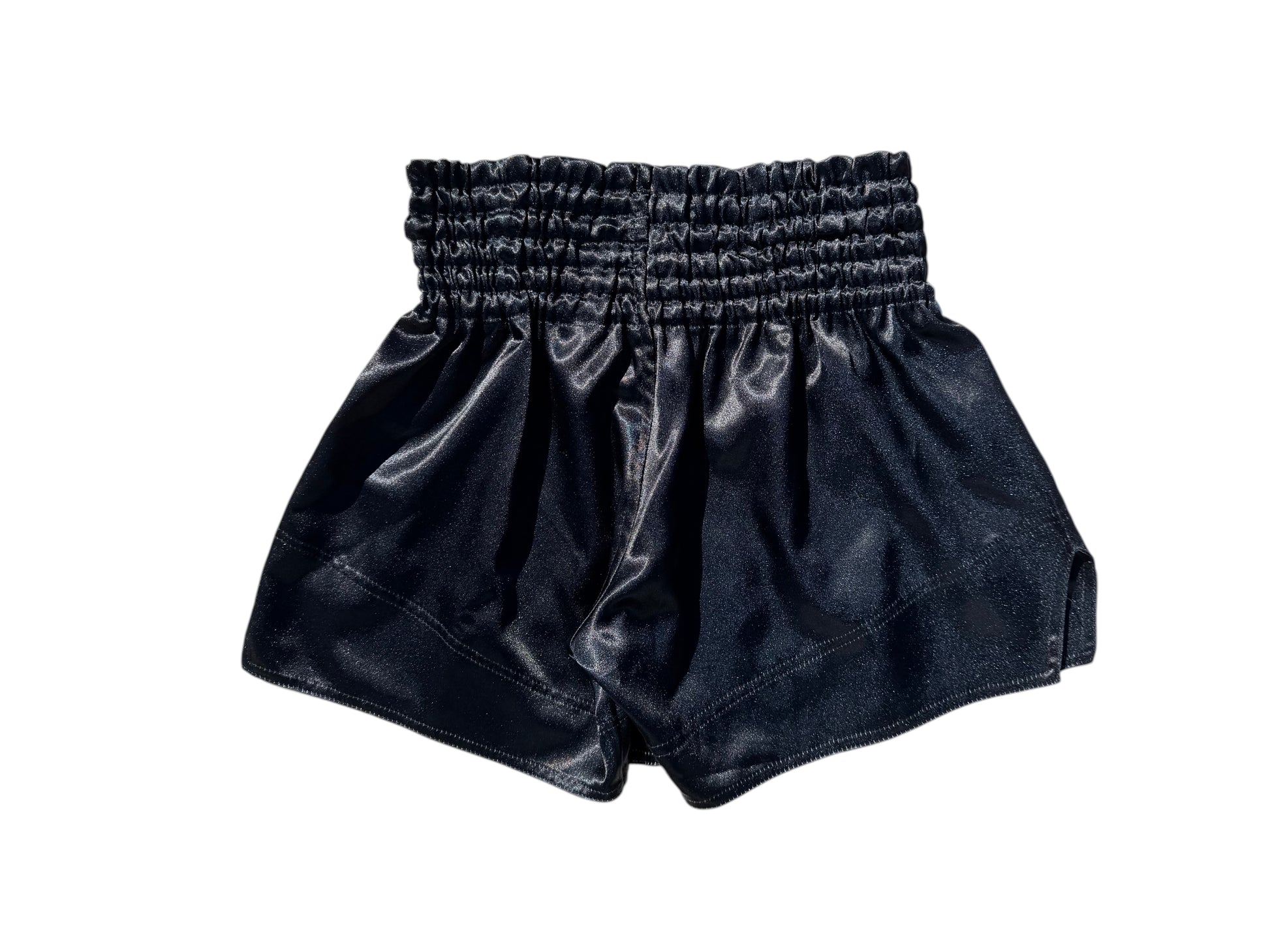 Lodestar Muay Thai black polyester shorts with elastic waistband and side openings for enhanced range of motion.