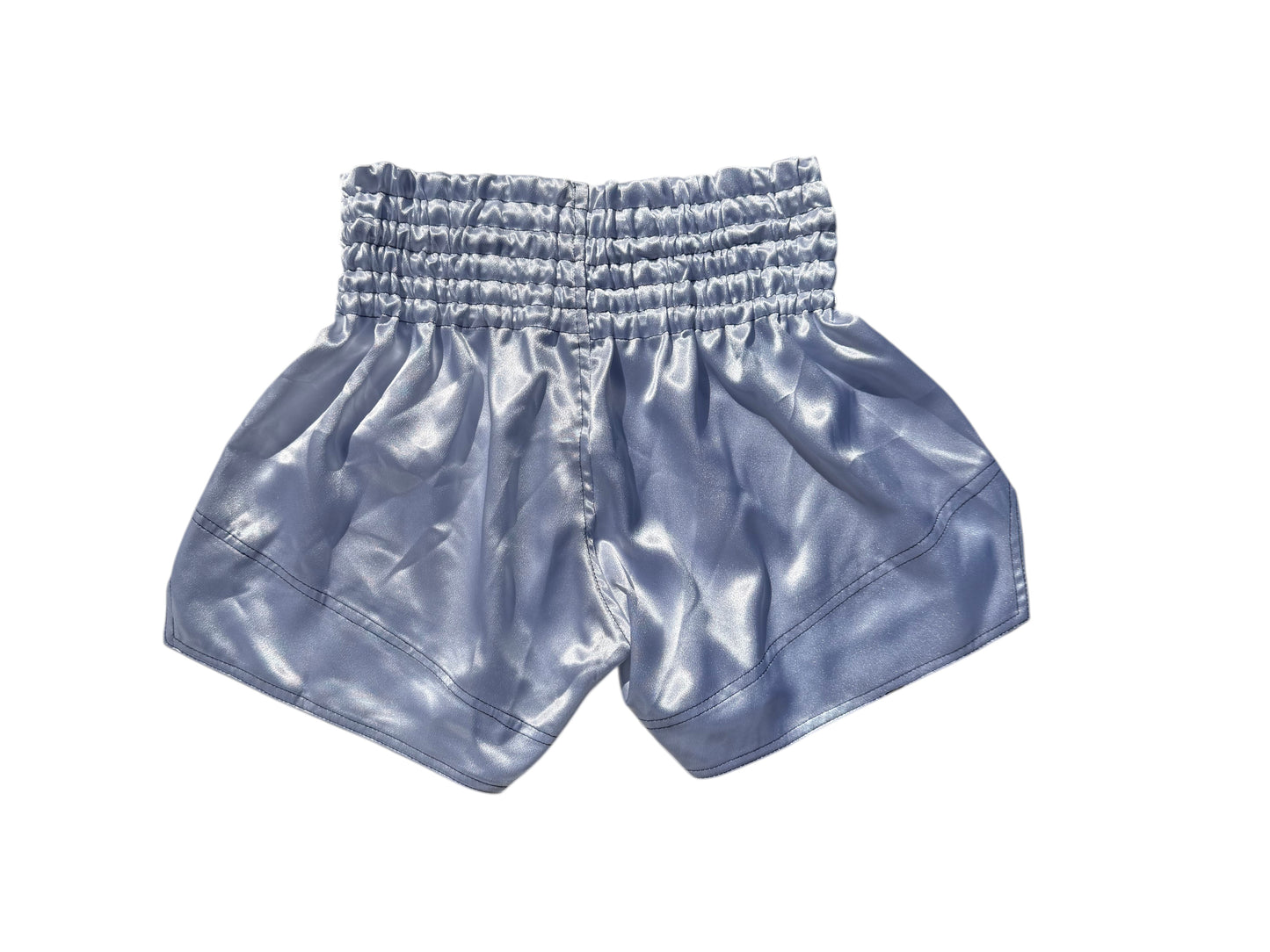 Lodestar Muay Thai shorts in light blue polyester with elastic waistband and side openings for enhanced range of motion.